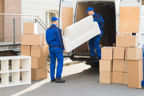 Furniture collection and delivery in a busy Clapham street