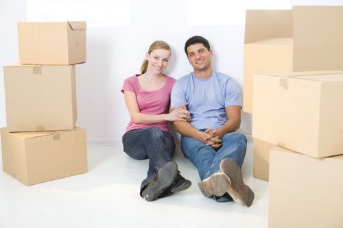Moving boxes and furniture on a local removal van in Clapham