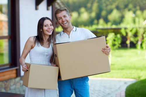 Movers carrying household items during a Clapham relocation