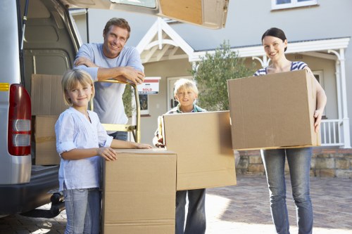 Local movers handling fragile household items with care