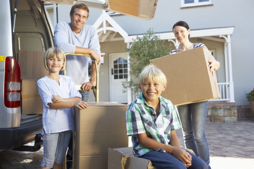 Worker handling boxed household items carefully