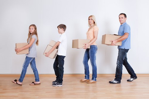 Careful loading of household items for removal services in Clapham
