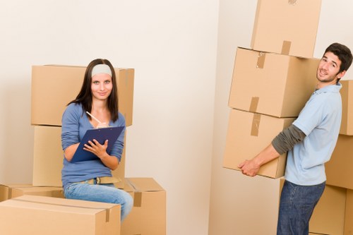 Careful loading of household items into a removal van