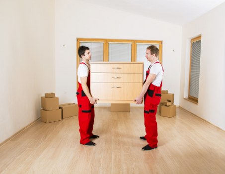 Packed moving boxes and wrapped furniture ready for house removals